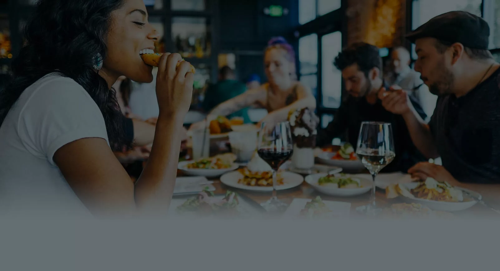 People eating food in a busy restaurant