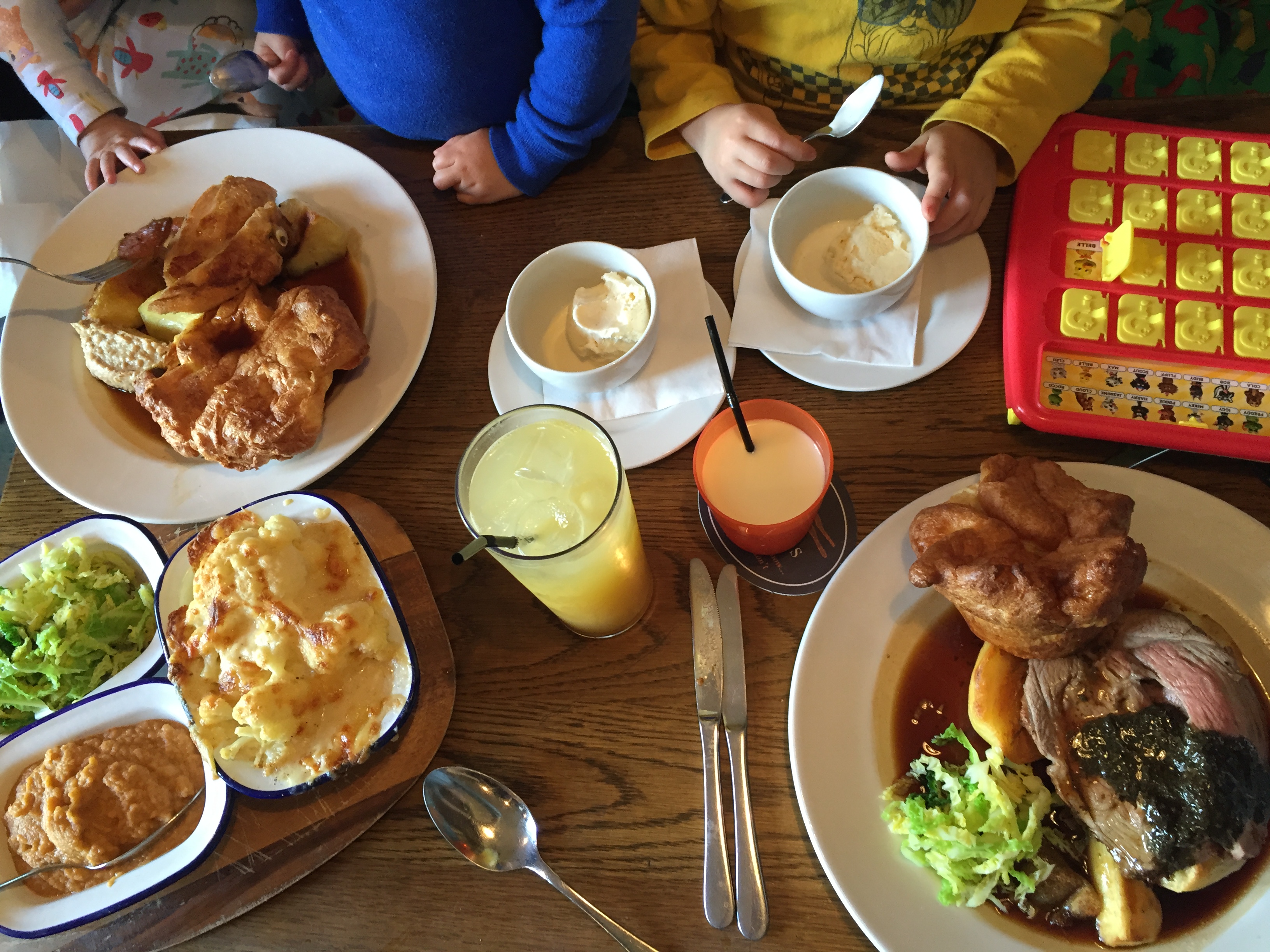 Birdseye view of a family eating sunday lunch at a pub
